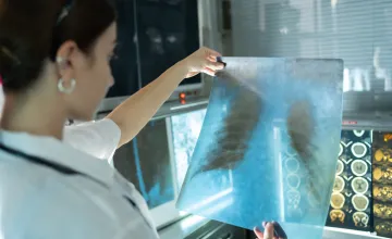 researcher looking at a scan